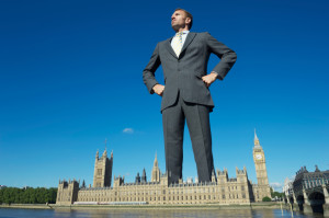 Man towering over building