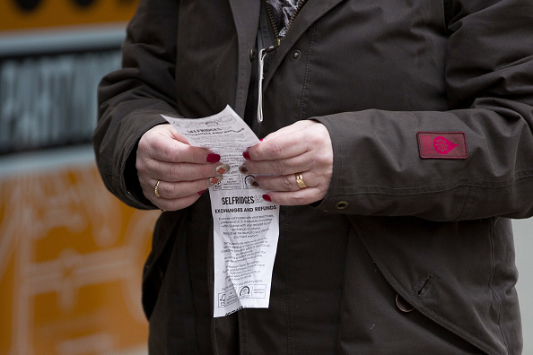 Shopper Inspects A Selfridges Plc Till Receipt On Oxford Street In Picture Id629313250