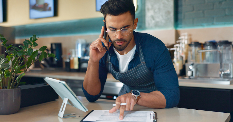 A business owner looking at a document.